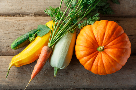 Fresh vegetables on wooden background in closeupの写真素材