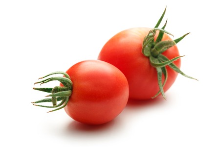 Fresh red tomatoes on the white backgroundの写真素材