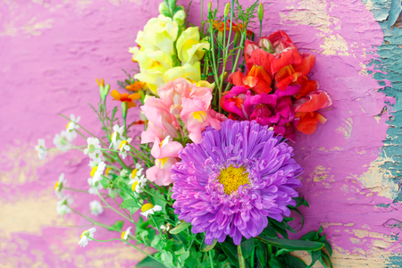 Bouquet of garden flowers on colorful backgroundの写真素材