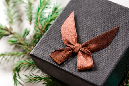 Christmas background with evergreen firtree branch and gift boxの写真素材