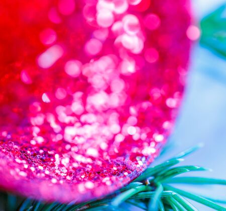 Christmas background with evergreen branch and jingle bellsの写真素材