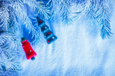 Christmas background with snow, toy and firtree branchの写真素材