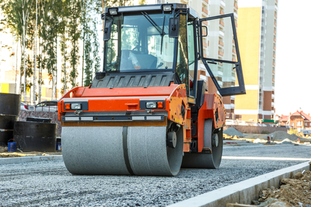 Road roller working at road construction siteの写真素材