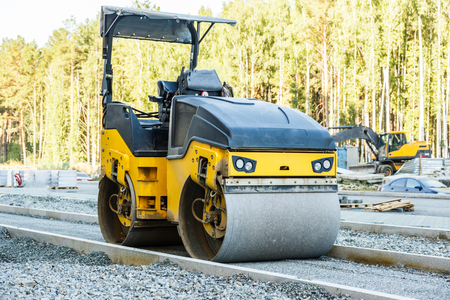 Road roller working at road construction siteの写真素材