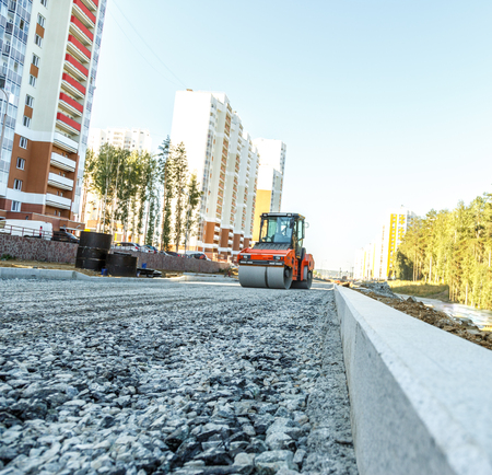Road roller working at road construction site