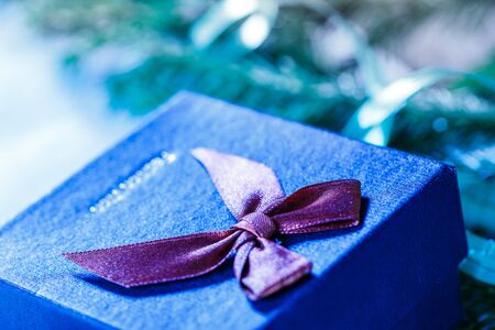 Christmas background with evergreen firtree branch and gift boxの写真素材