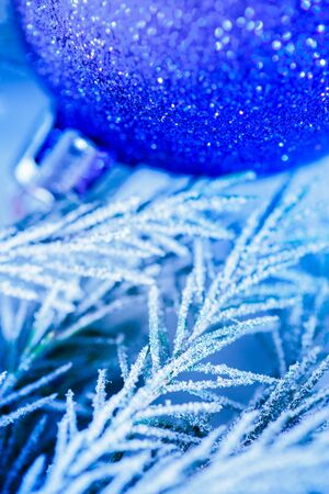 Christmas background with snow, toy and firtree branchの写真素材