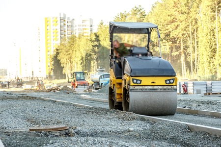 Road roller working at road construction siteの写真素材