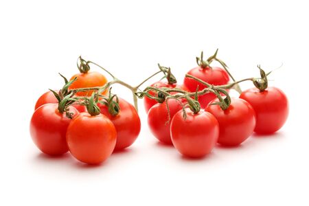 Fresh red tomatoes on the white backgroundの写真素材