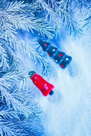 Christmas background with snow, toy and firtree branchの写真素材