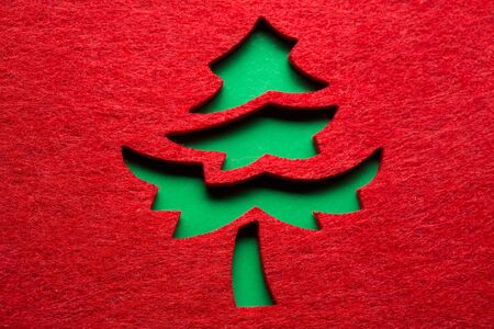 Christmas decorative tree silhouette of red textileの写真素材