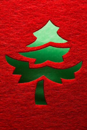 Christmas decorative tree silhouette of red textileの写真素材
