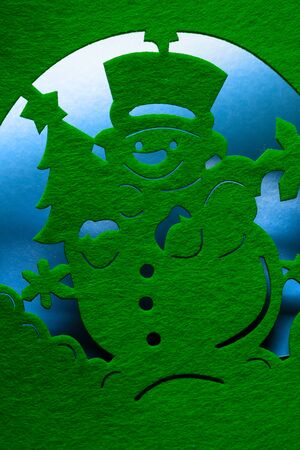 Christmas decorative snowman silhouette of green textileの写真素材