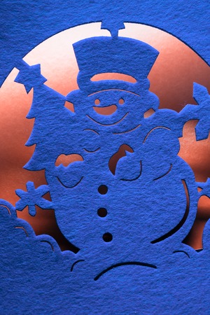 Christmas decorative snowman silhouette of blue textileの写真素材