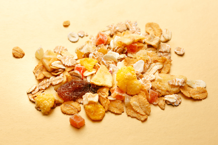 Heap of fresh musli with raisin on paper backgroundの写真素材
