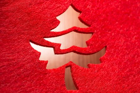 Christmas decorative tree silhouette of red textileの写真素材