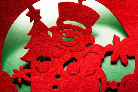 Christmas decorative snowman silhouette of red textileの写真素材