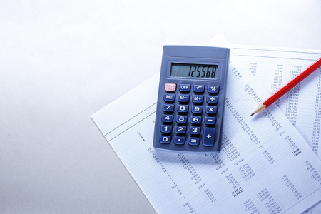 Operating budget, calculator and pencil in closeupの写真素材