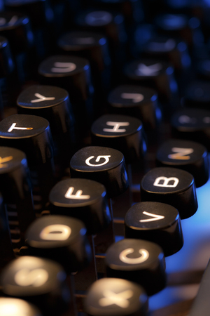 Keyboard of typewriter in blue toningの写真素材