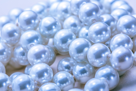 Necklace of white pearl as background in closeupの写真素材