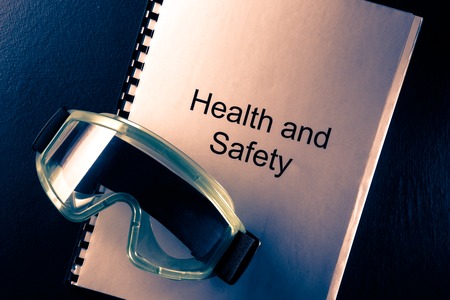 Health and safety document with goggles in toningの写真素材