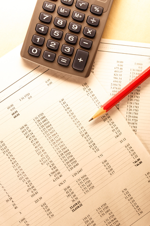 Operating budget, calculator and pencil in closeupの写真素材