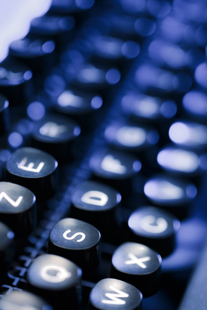 Keyboard of typewriter in blue toningの写真素材