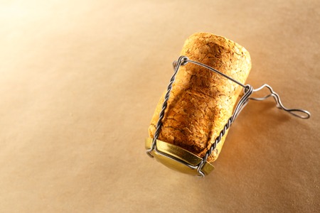 Champagne cork on paper background in closeupの写真素材