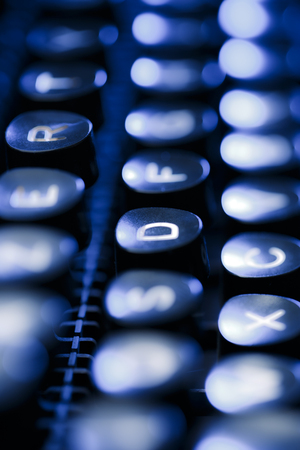 Keyboard of typewriter in blue toningの写真素材