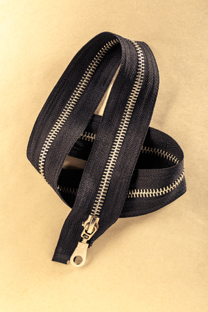 Black zipper on the paper backgroundの写真素材