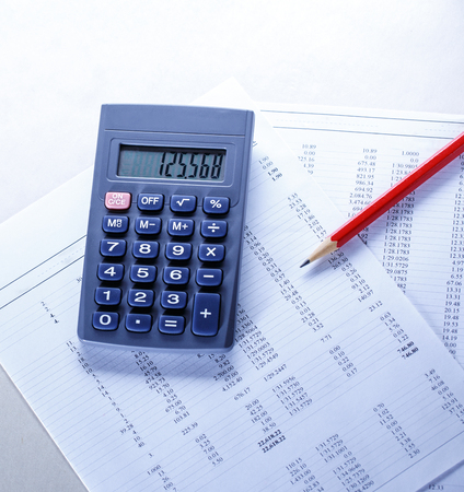 Operating budget, calculator and pencil in closeupの写真素材