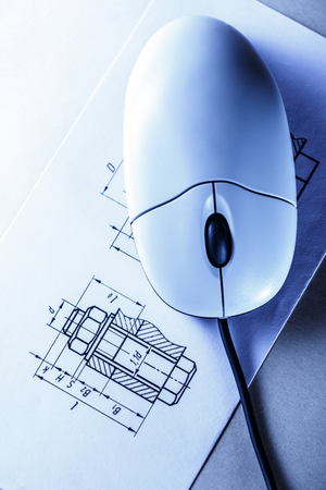 Drafting and computer mouse in toning closeupの写真素材