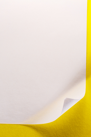 Blank sheet of paper on yellow backgroundの写真素材
