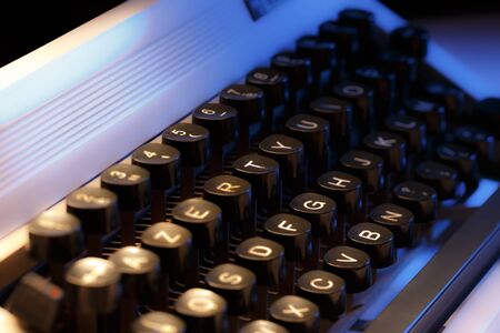 Keyboard of typewriter in blue toningの写真素材