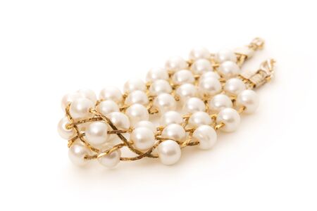 Wristband with golden chain and white beadsの写真素材