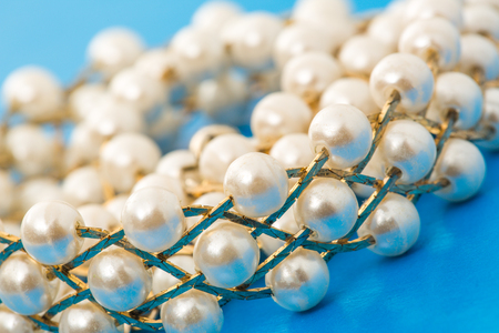 Necklace with golden chain and white beadsの写真素材