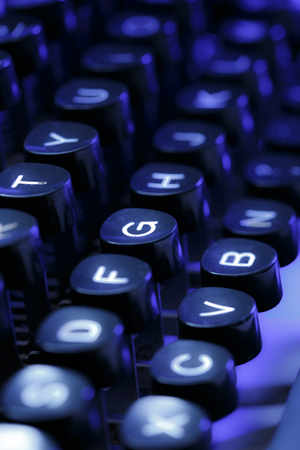 Keyboard of typewriter in blue toningの写真素材