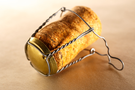 Champagne cork on paper background in closeupの写真素材