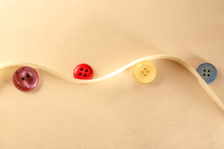 Colourful buttons and decorative ribbon in closeupの写真素材