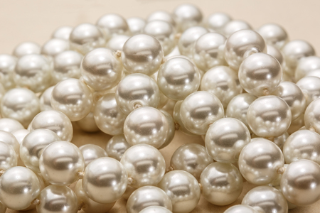 Necklace of white pearl as background in closeupの写真素材