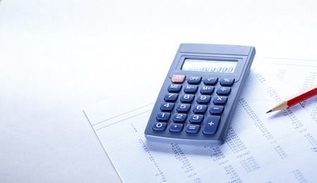 Operating budget, calculator and pencil in closeupの写真素材