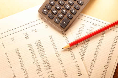 Operating budget, calculator and pencil in closeupの写真素材