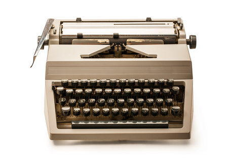 Old-fashioned typewriter with latin alphabet on whiteの写真素材