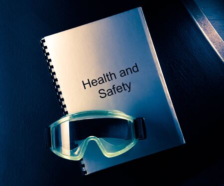 Health and safety document with goggles in toningの写真素材