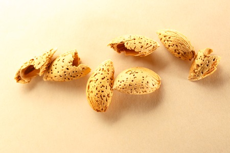 Dry almond nuts with shadow in closeupの写真素材