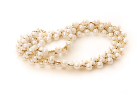Necklace with golden chain and white beadsの写真素材