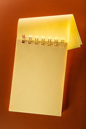 Blank open notebook on the brown backgroundの写真素材