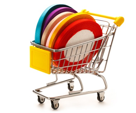 Market pushcart with ribbon rolls in closeupの写真素材