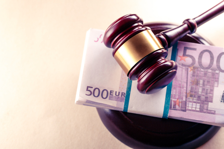 Wooden judge's gavel and euro in toningの写真素材