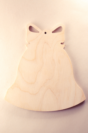 Blank wooden cutting board in bell formの写真素材